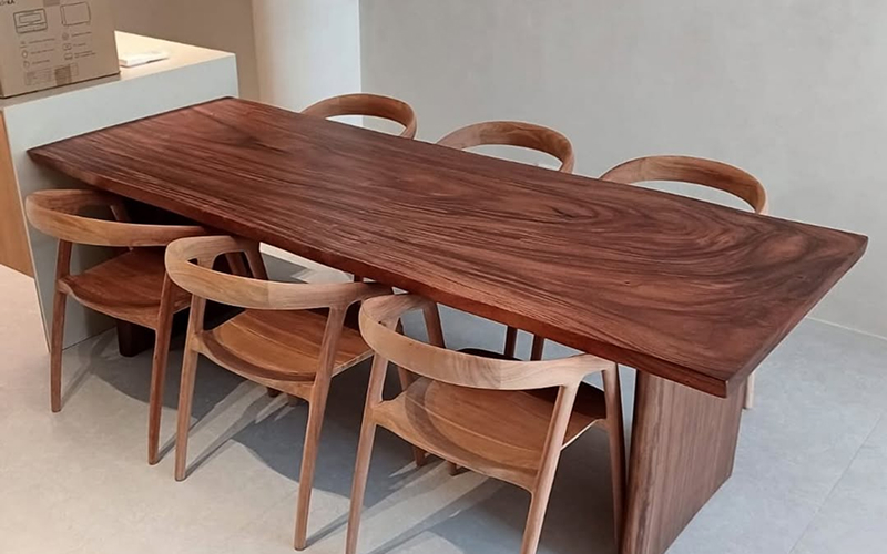 02 25 Wood Capitol Suar wood dining table with slab legs.