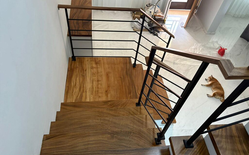 Overhead view of a solid wood staircase and matching handrail Overhead view of a solid wood staircase and matching handrail