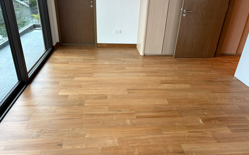 Solid wood plank flooring installed in a Singapore apartment.